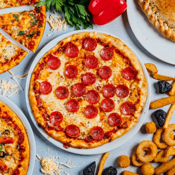 Pepperoni, cheese, and unique pizzas, a calzone, and fried snacks like onion rings and fries.